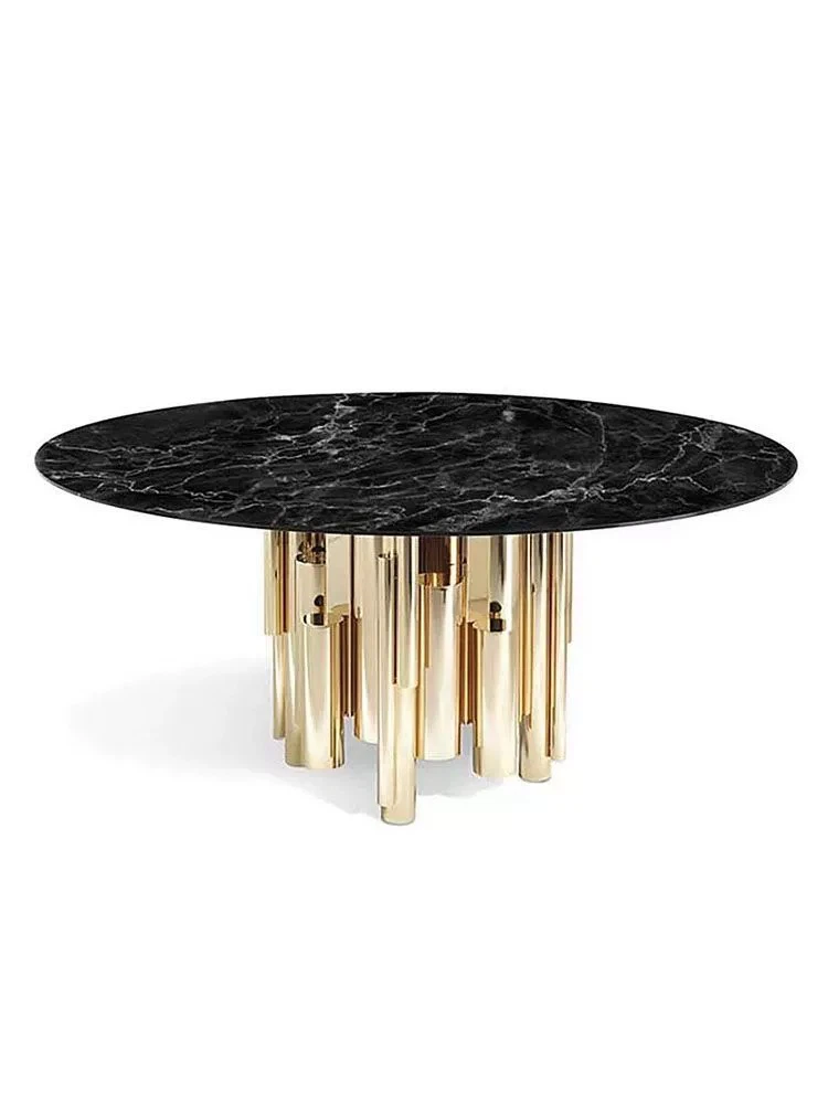 Elegant contemporary table featuring black marble top and golden stainless steel cylindrical base. Elegant contemporary table featuring black marble top and golden stainless steel cylindrical base.